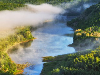 foggy spring morning. picturesque river canyon. fog in the valley