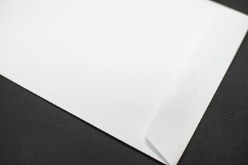 White envelope on black background.