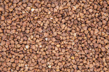 Dark Buckwheat Texture. Background Buckwheat Groats Close-up.