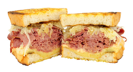 Pastrami Reuben style sandwiches with sauerkraut and melted Swiss cheese isolated on a white background