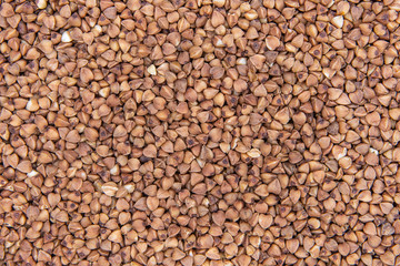 Dark Buckwheat Texture. Background Buckwheat Groats Close-up.