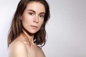 Fototapeta premium Beauty Woman Face Portrait. Beautiful Spa Model Girl with Perfect Fresh Clean Skin. Youth and Skin Care Concept