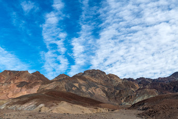 Altocumulous clouds over the mountains at Artist's Palette in Death Valley National Park, California, USA