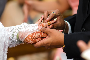 bride and groom holding hands