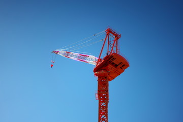 Tokyo,Japan-December 24, 2018: A Giant Red Climbing Crane with blue sky background 