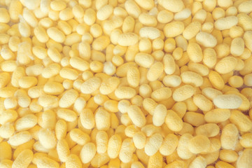 Blurred for background.Golden silk from the local silk. Raw materials for weaving.