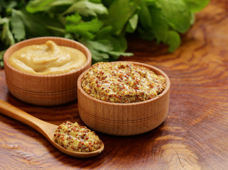 Natural mustard, seasoning and sauce on a wooden table