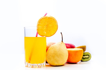 different fruit and juice or smoothie in a glass
