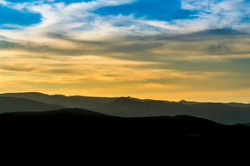 Obraz premium Layers of Mountains at Sunset