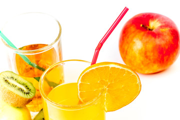 different fruit and juice or smoothie in a glass