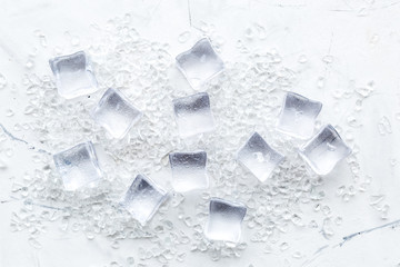 pile of ice cubes on marble bar table top view