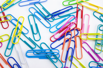 Office supplies colorful concepts, paper clips on white background, Abstract background, Closeup, Top view.