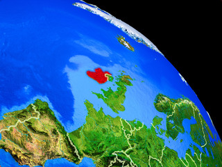 Ireland on planet Earth from space with country borders. Very fine detail of planet surface.
