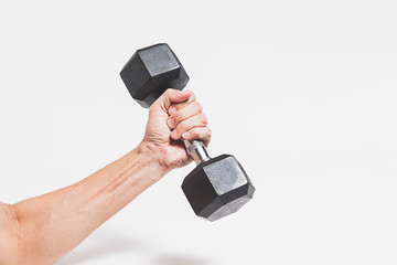 the hand holds a dumbbell for playing sports