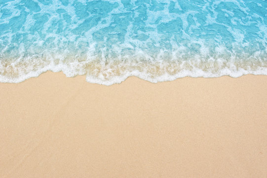 beautiful sandy beach and soft blue ocean wave © OHishi_Foto