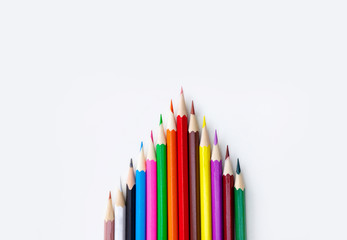 Art and drawing creative concepts of colorful crayon pencils with triangle shape on white background with copy space. Top view, Close-up, For banner design.