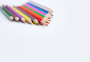 Closeup tips of colorful pencils with selected focus on white background with copy space. Drawing, Art, Creativity concept.