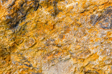 The colorful surface  of the rock cliff