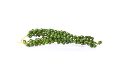 Fresh green peppercorns isolated on a white background.