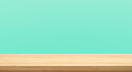 Empty of wood table top on green pastel color background.For montage product display or design key visual