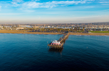 Drone shot from above of a coastal pier in Newport Beach, Orange County, California