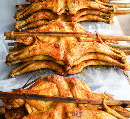 Grilled Chicken with bamboo stick thai Local style grilled chicken food