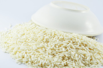 rice in cup on white background / raw white Jasmine rice dry for food