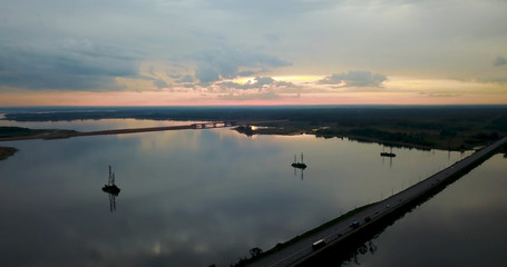Beautiful sunset over the river Volga, a reflection of the sunset