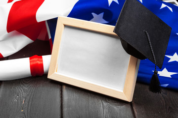 graduation hat on US flag, education concept