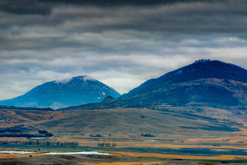Fototapeta premium Panorama of the mountain valley with big snow mountain on background