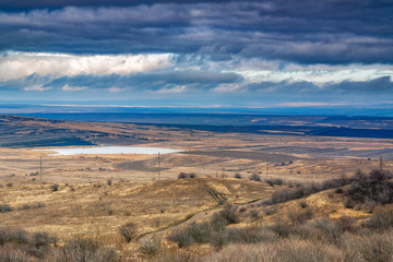 Panorama of the mountain valley with big snow mountain on background