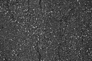 crack and texture of asphalt road - top view background.