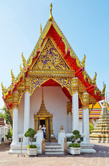 Fototapeta premium Bangkok, Thailand Wat Pho Temple Of The Reclining Buddha. Pagoda. There are many beautiful pagodas on the territory. Richly decorated roofs are visible everywhere. 