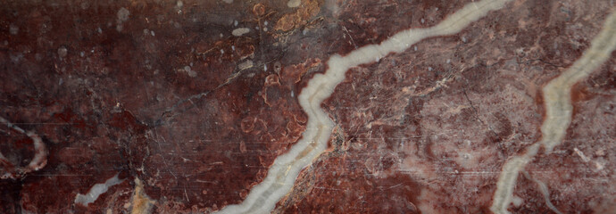 Red stone texture with white streaks