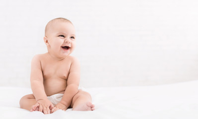 Cute baby sitting on white background, copy space - obrazy, fototapety, plakaty