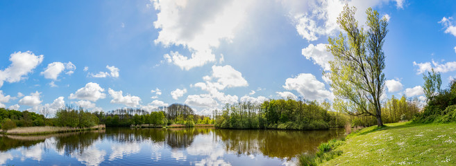Panorama photo in the spring of a pond in the Westerpark in Zoetermeer, Netherlands