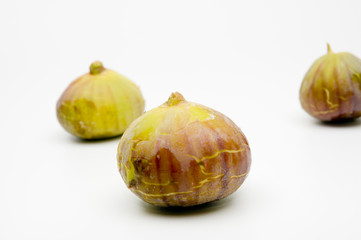 Fresh ripe figs on white background
