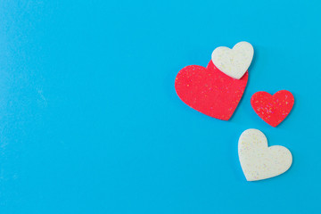  heart on blue background close up image.