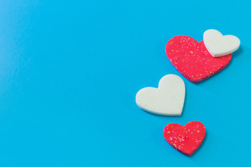  heart on blue background close up image.