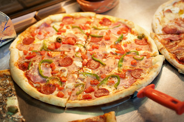 Slice of pizza pepperoni on scapula