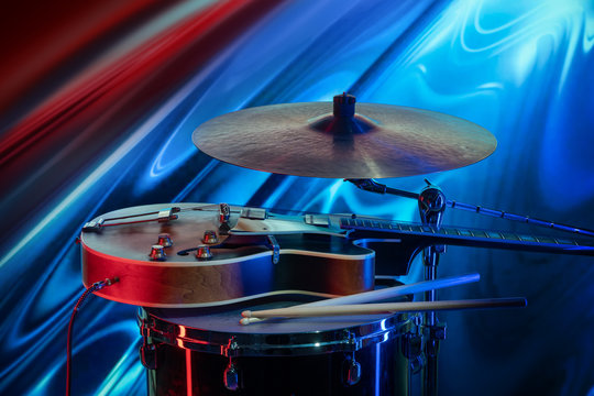 Ensemble-electric guitar, drum with sticks and plate