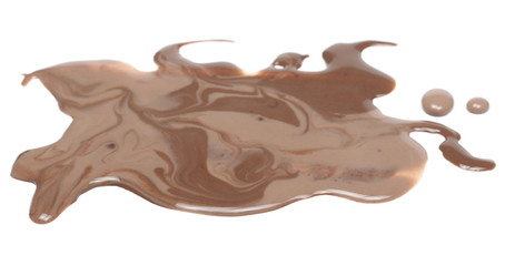Spilled chocolate milk puddle isolated on white background