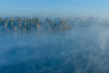 Fototapeta premium City Kremenchug in fog on autumn day