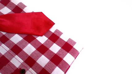 Fototapeta na wymiar Red and white plaid shirt with red necktie...white background.