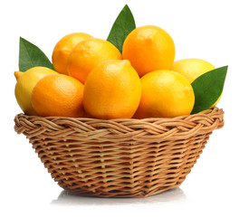 Lemons in basket isolated on white