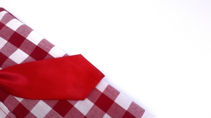Red and white plaid shirt with red necktie...white background.