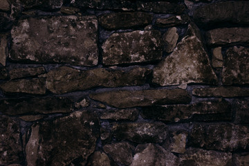 Ancient stone fence shot close.