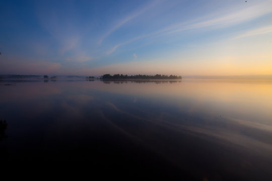 Dawn on the lake. The blue and scarlet sky © Mikhail Semenov