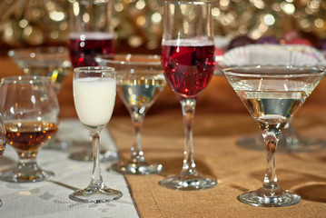 Glass glasses with colored drinks on the table. alcoholic drinks at the buffet