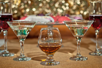 Glass glasses with colored drinks on the table. alcoholic drinks at the buffet